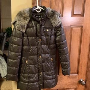 Fashionable winter coat with faux fur hood.